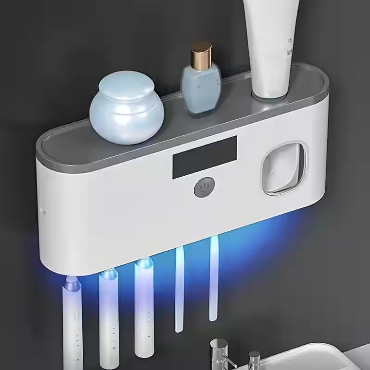 Esterilizador de pared con dispensador integrado sobre repisa de baño
